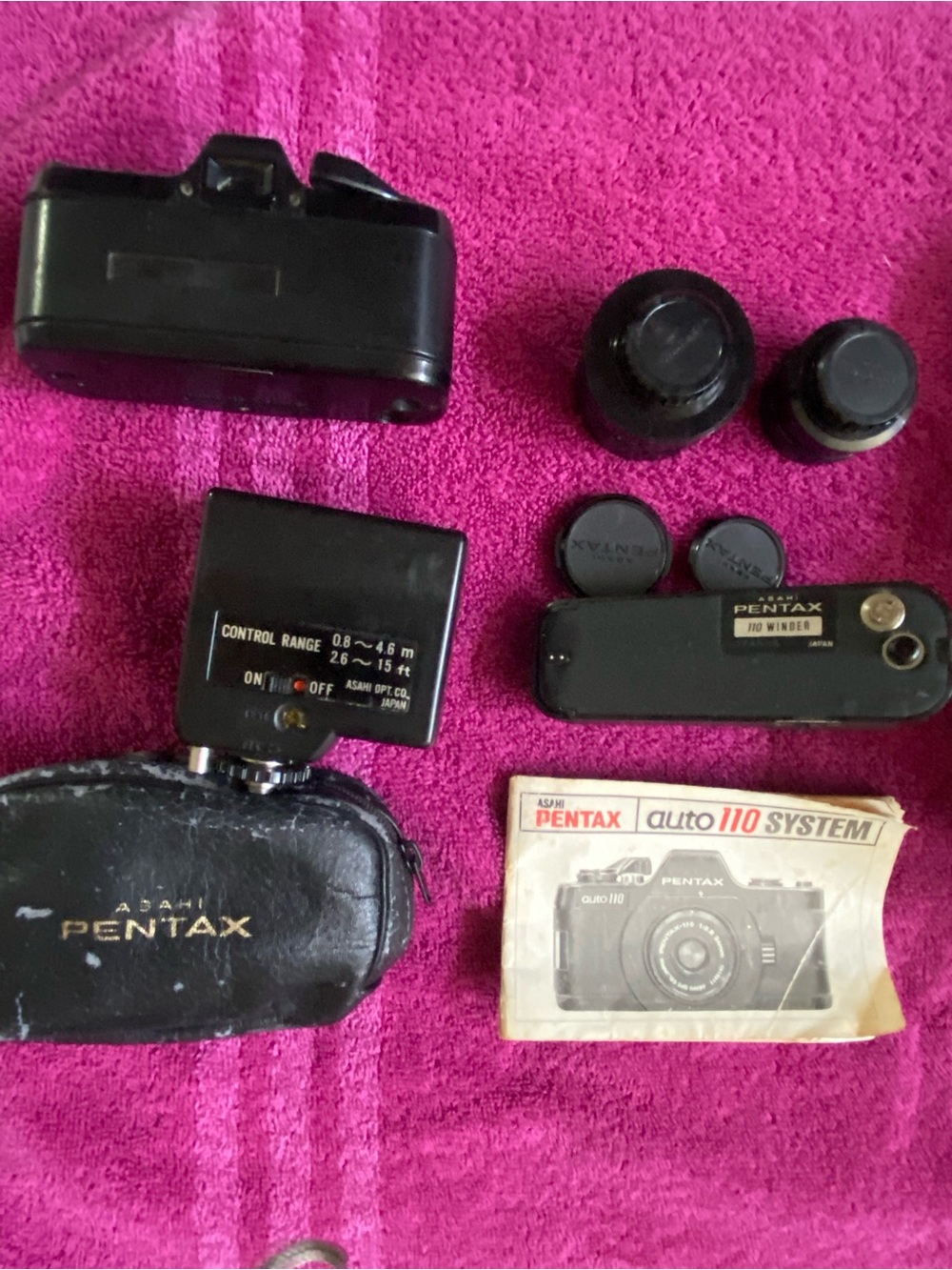 Pentax black camera accessories set with black caps and case